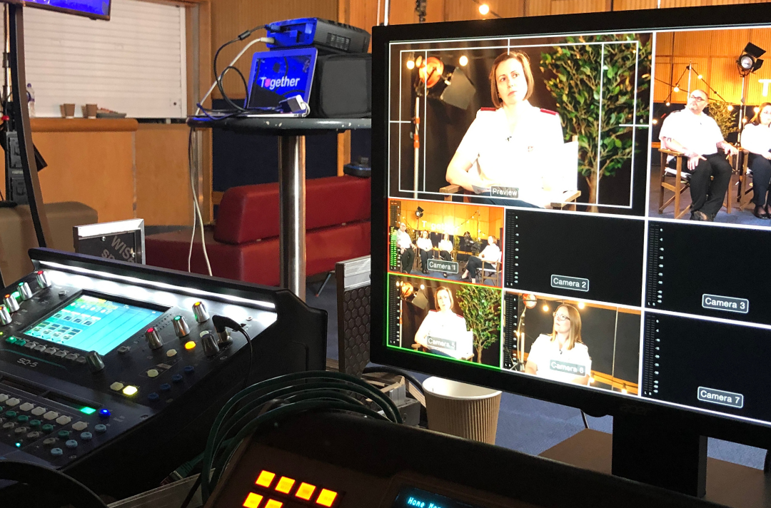 A photo shows an AV desk live-streaming a Salvation Army event.