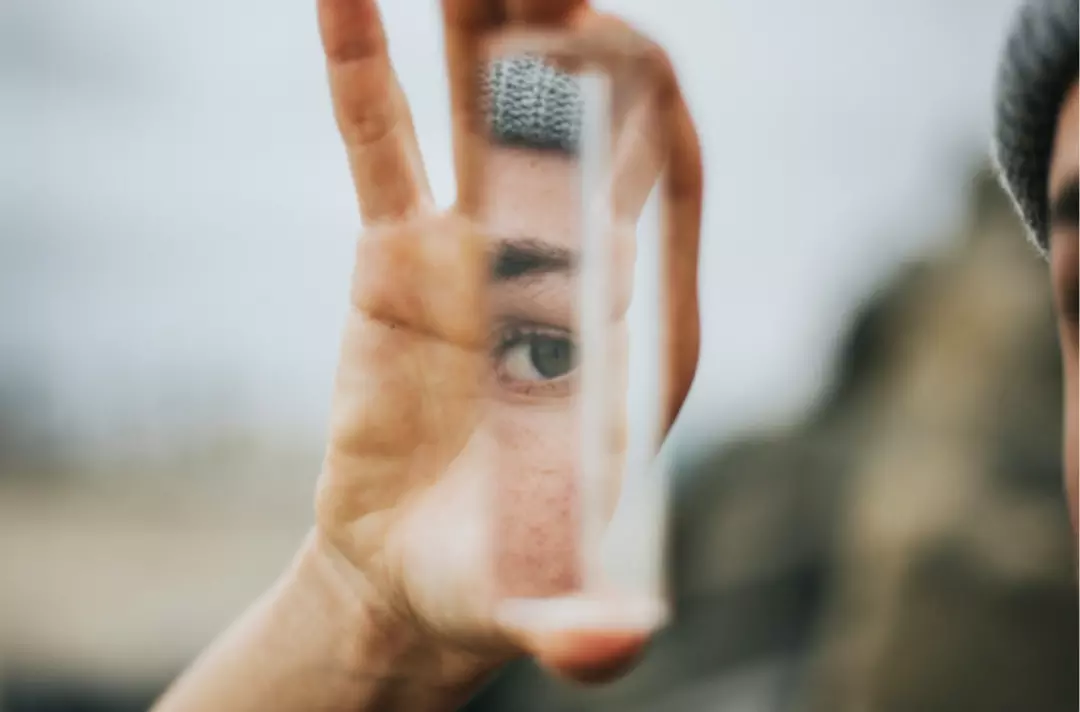 A photo of an eye reflected in a mirror