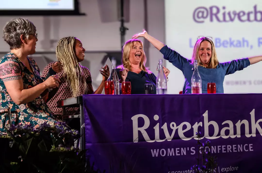 A photo shows the @Riverbank panel at Riverbank 2024.