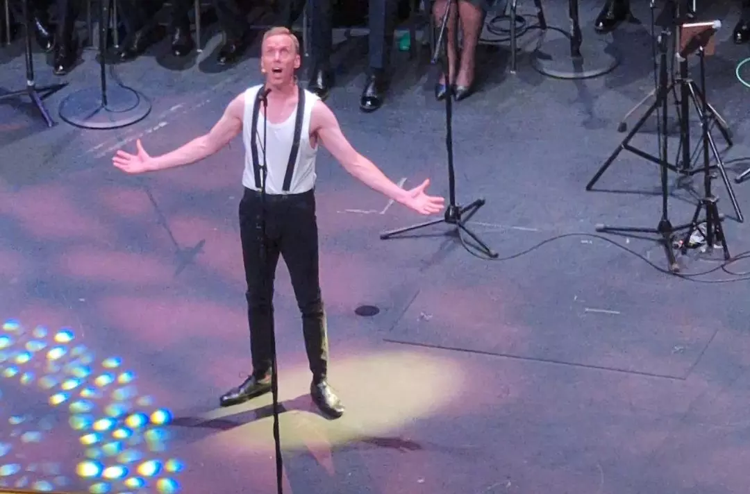 A photo of Rob Moye singing on stage at Together 2024