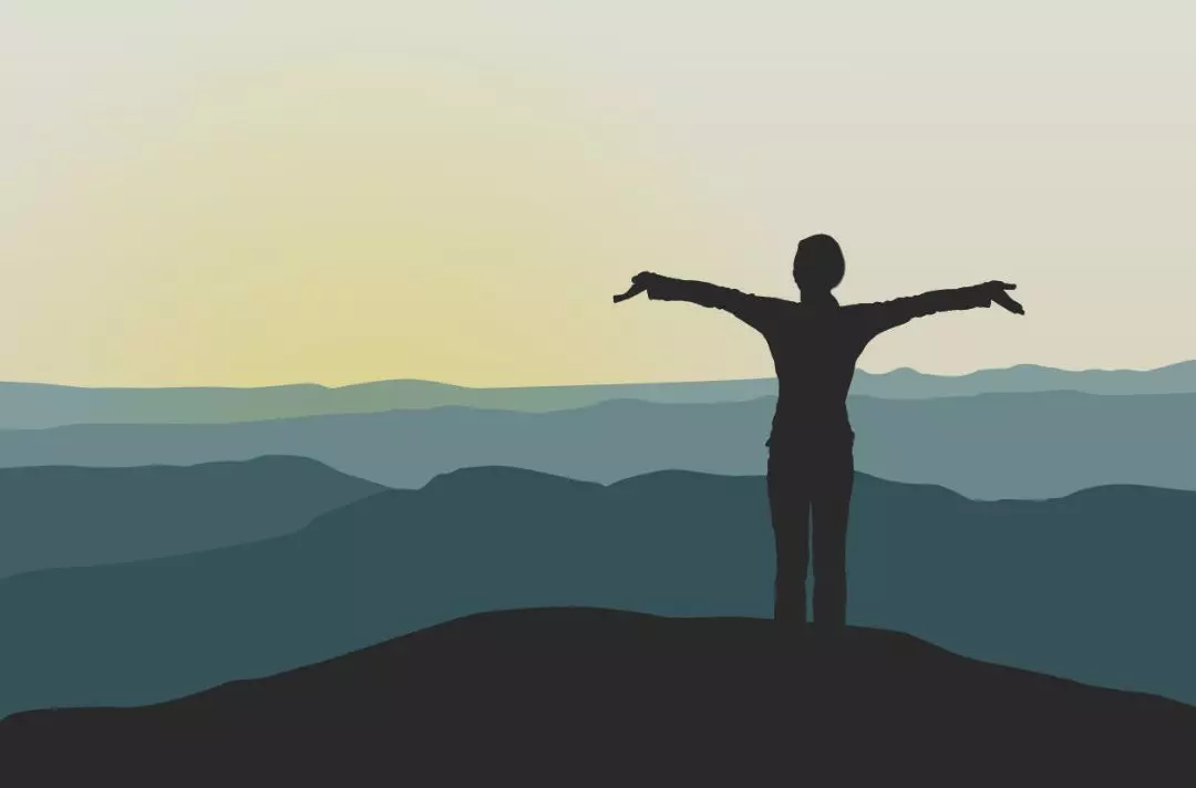 A photo of a silhouette with their arms outstretched