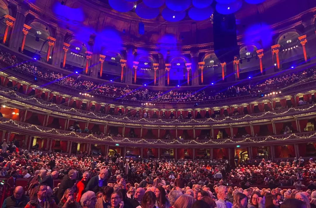 The audience are taking their seats