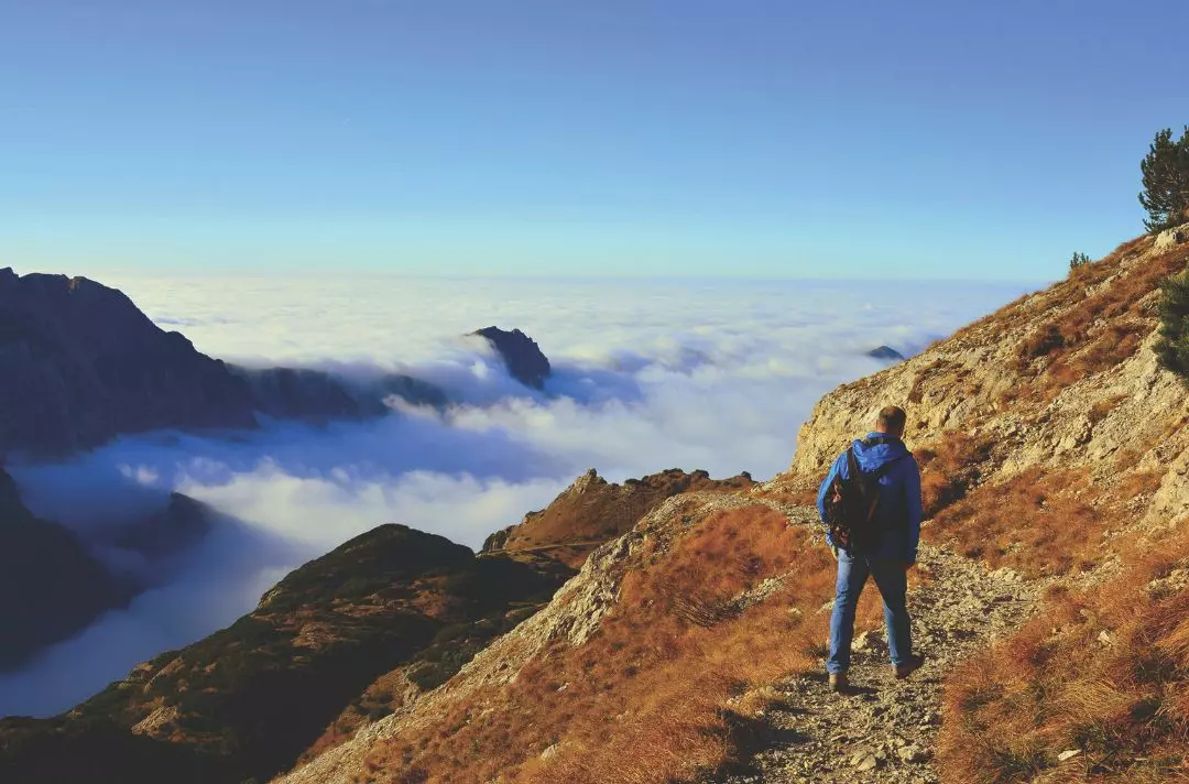 Man hiking through mountains
