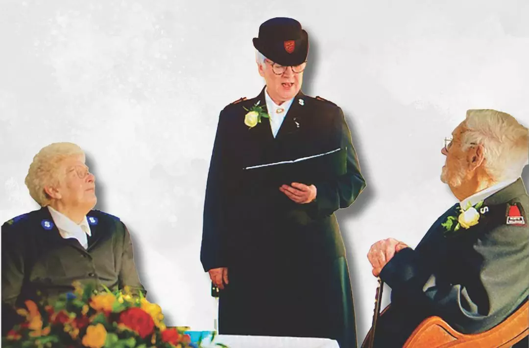 A photo of Pauline and Jim being married by Territorial Envoy Ruth