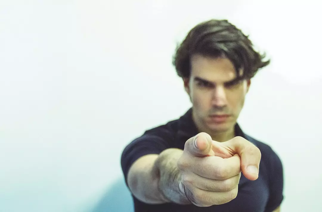Man pointing accusatory finger.