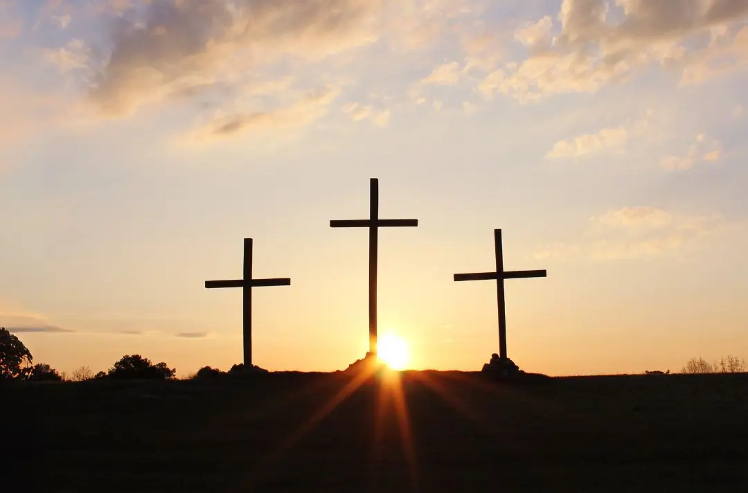 A photo of three crosses on a hill