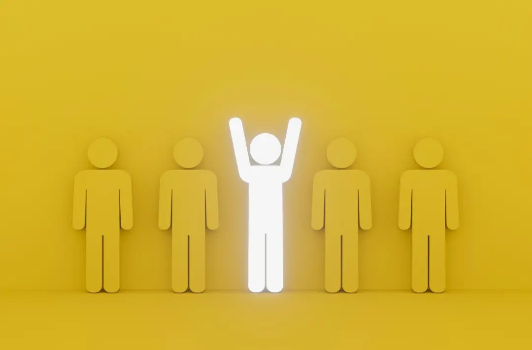 A graphic shows a series of yellow figures against a yellow background, with one white figure standing with its arms raised.