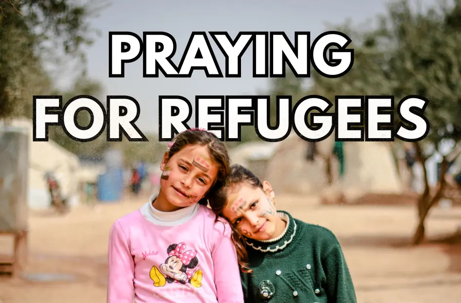a photo of two girls in a refugee camp, with the text 'praying for refugees'