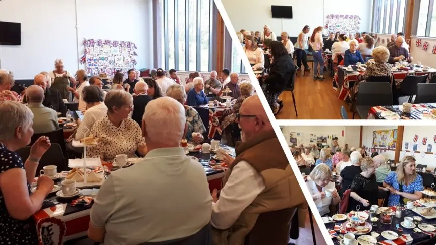photo of VE day - lots of people sat around tables having tea and coffee