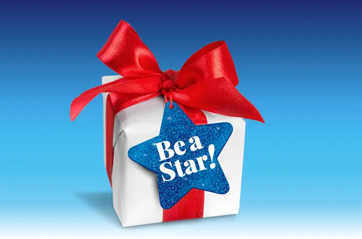 blue gradient background with present wrapped with a red bow