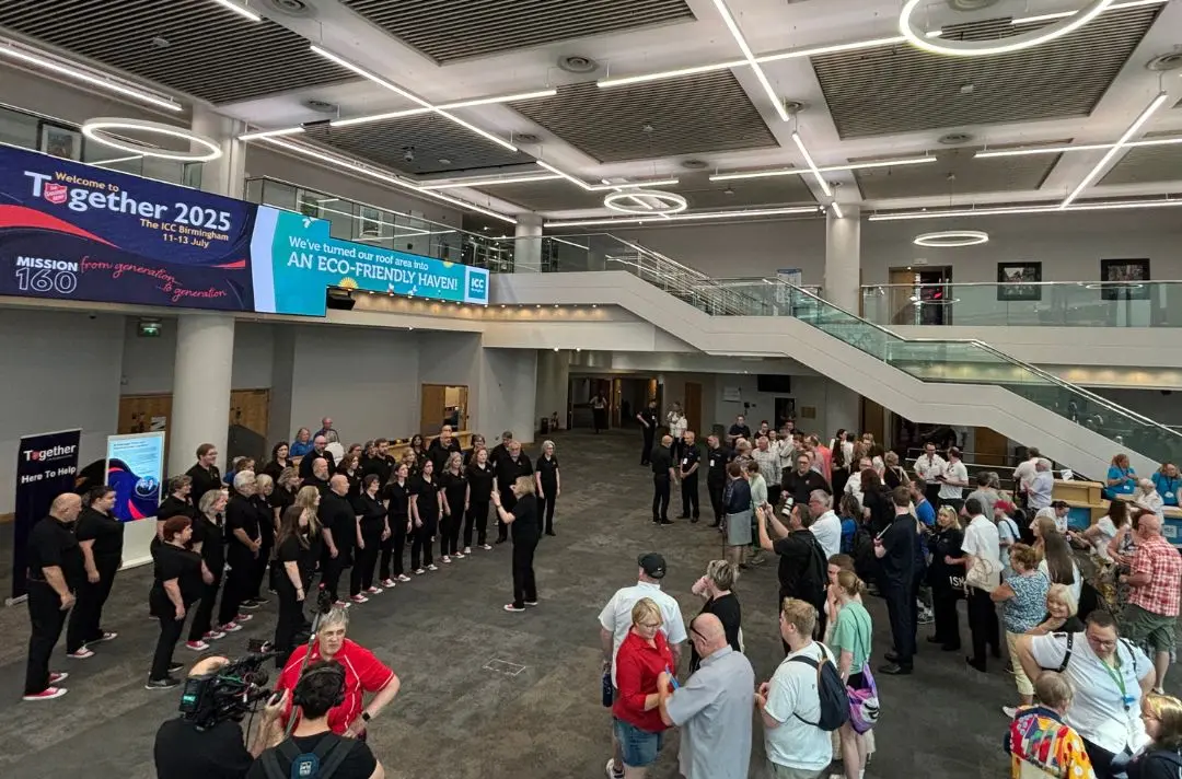 The Canadian Staff Songsters singing in the foyer of the ICC
