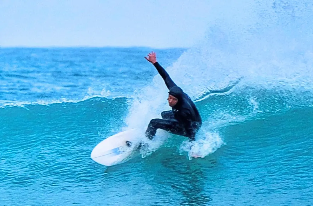 A photo shows someone surfing.