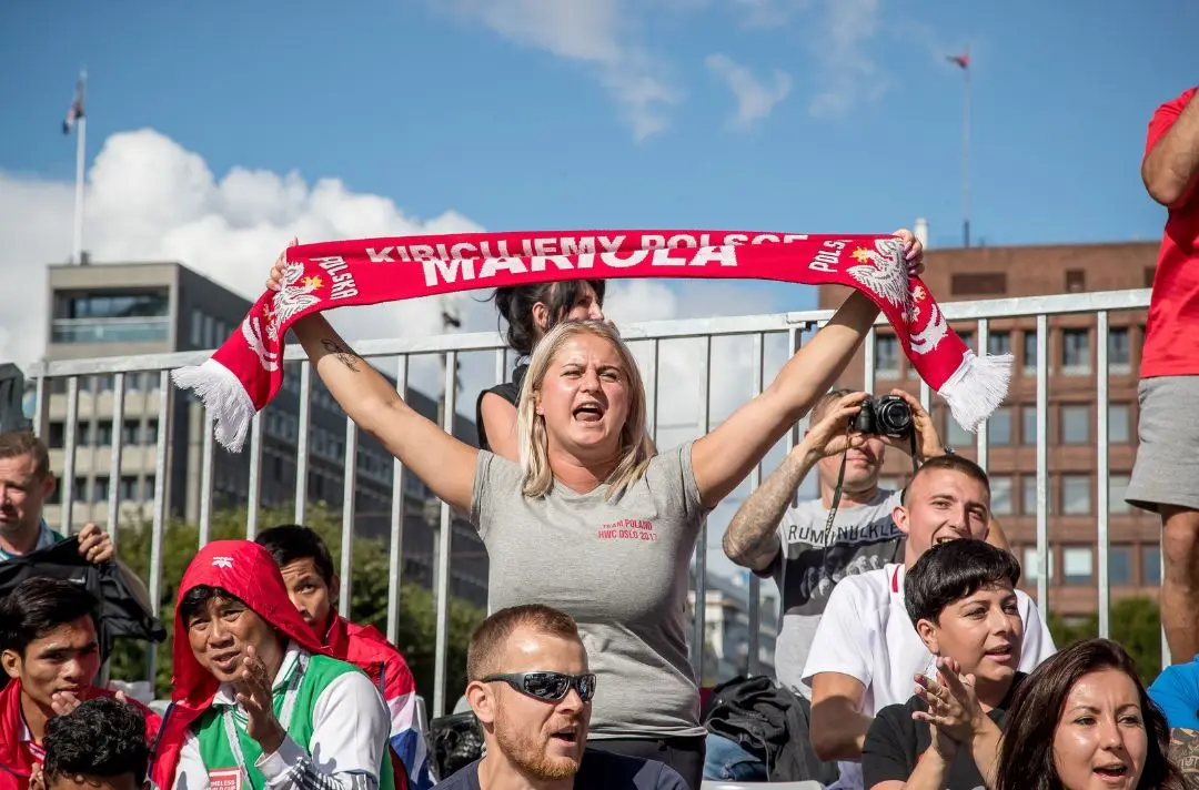 Crowd cheering homelessness world cup