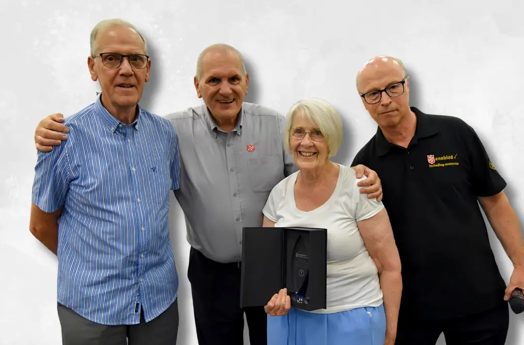 A photo shows Majors Barbara and Harry Wilson with Mitch Menagh and Chris Stringer.jpg