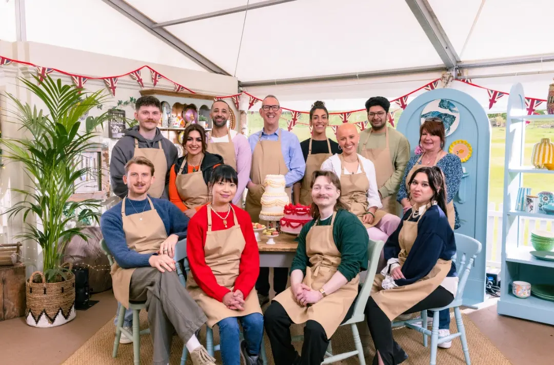 A photo shows contestants of The Great British Bake Off.