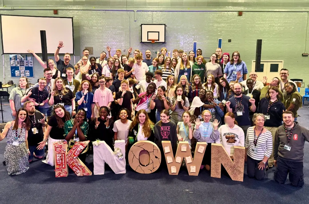 A photo shows summer school students gathered for a group picture.