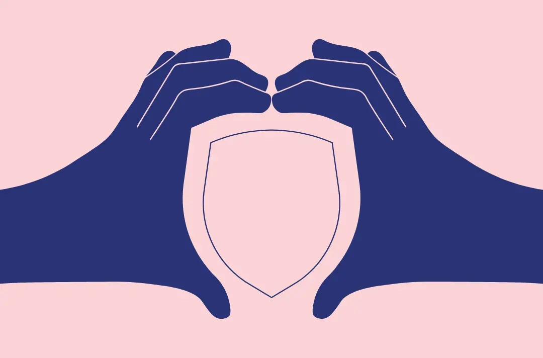 An illustrator shows hands posed to make the shape of a shield.