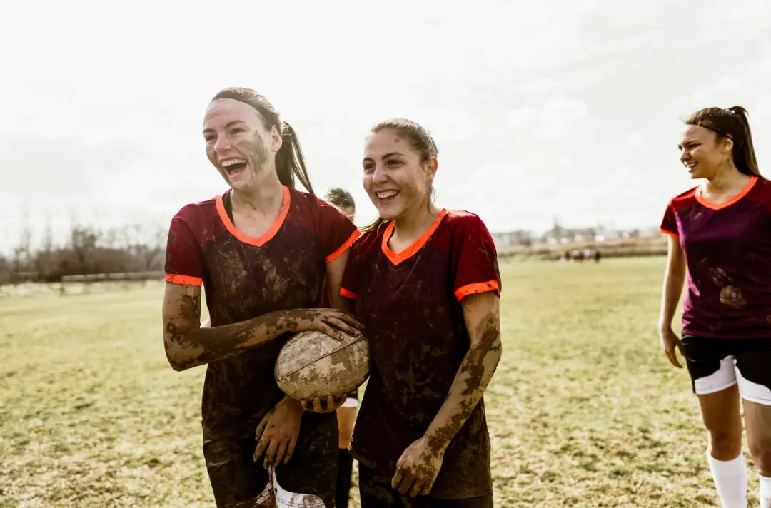 A photo shows people playing rugby.