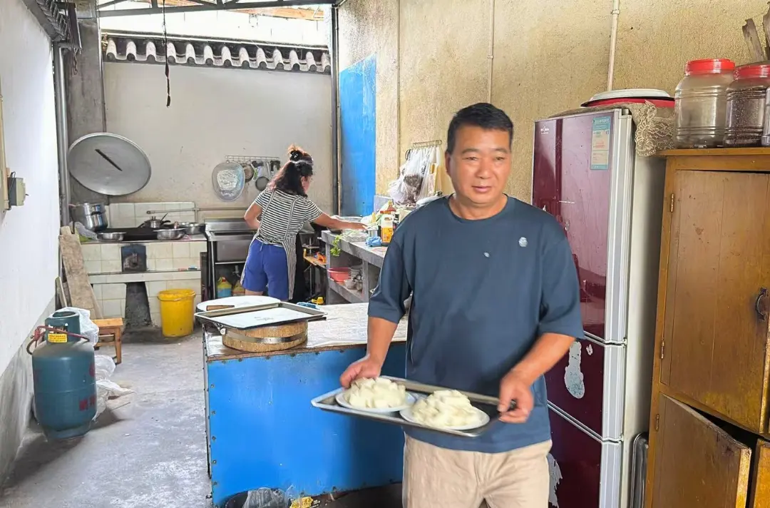 A photo shows people preparing food.