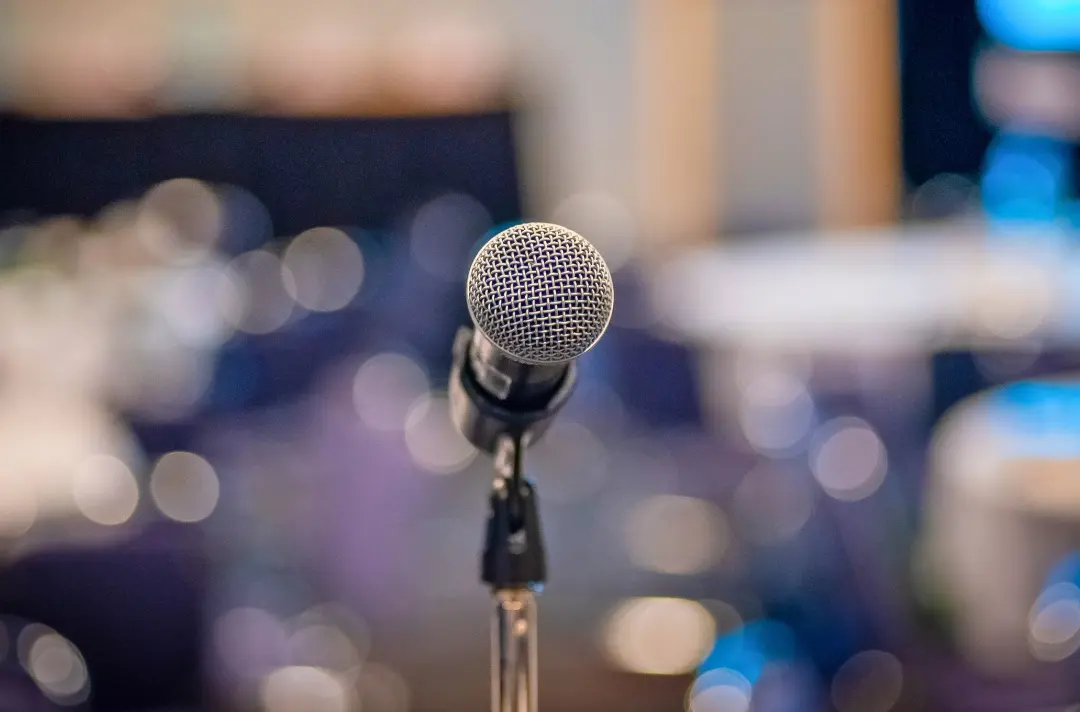 A photo shows a microphone ready for use.