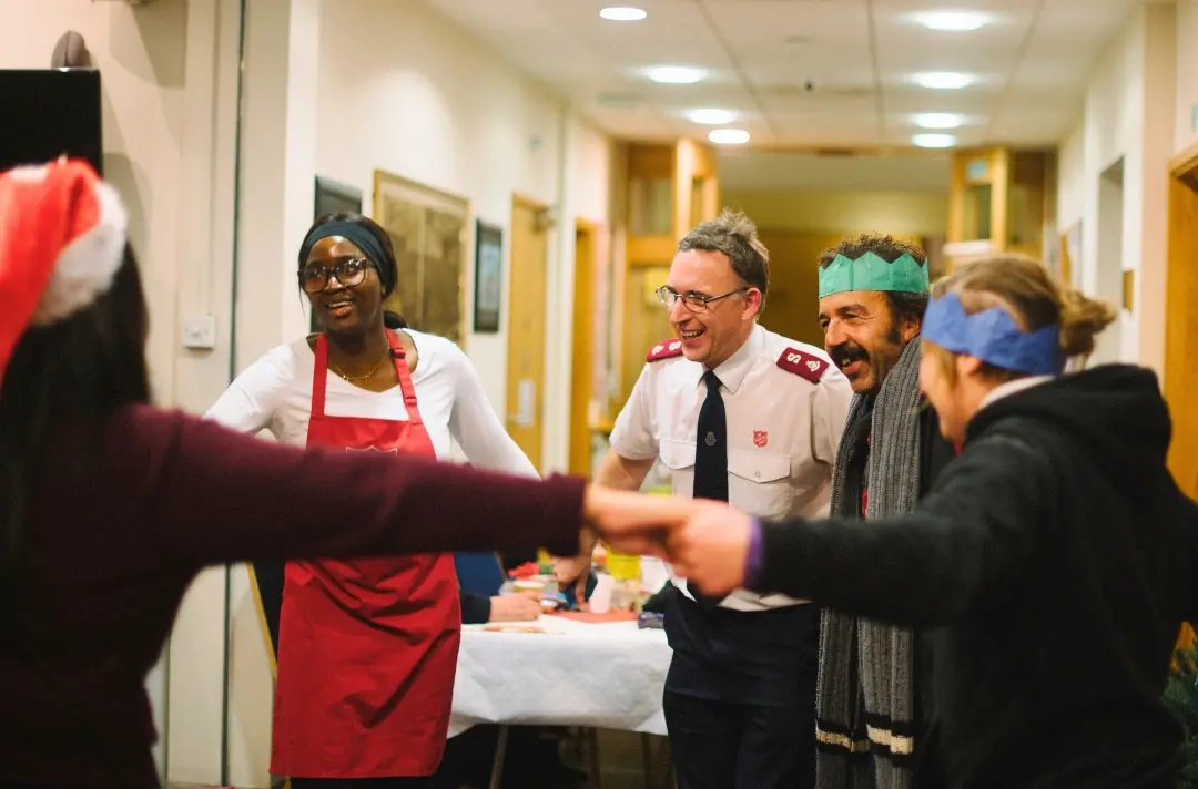 A photo shows people celebrating Christmas at Chalk Farm Corps.