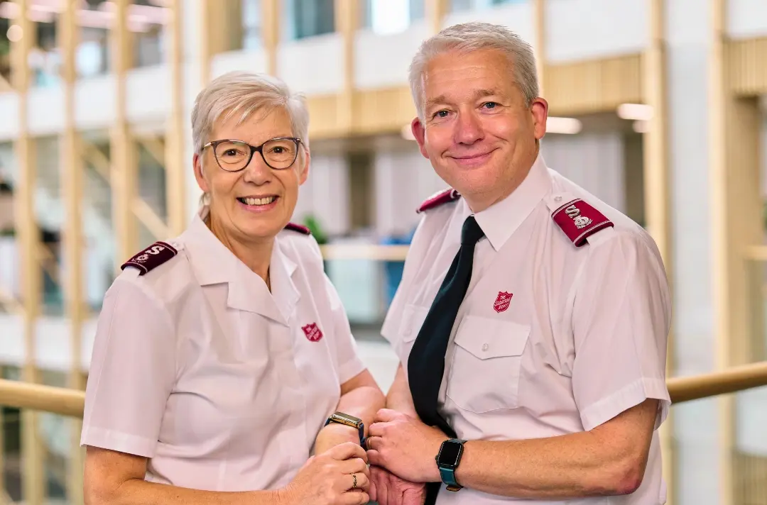 A photo shows territorial leaders Commissioners Jenine and Paul Main.