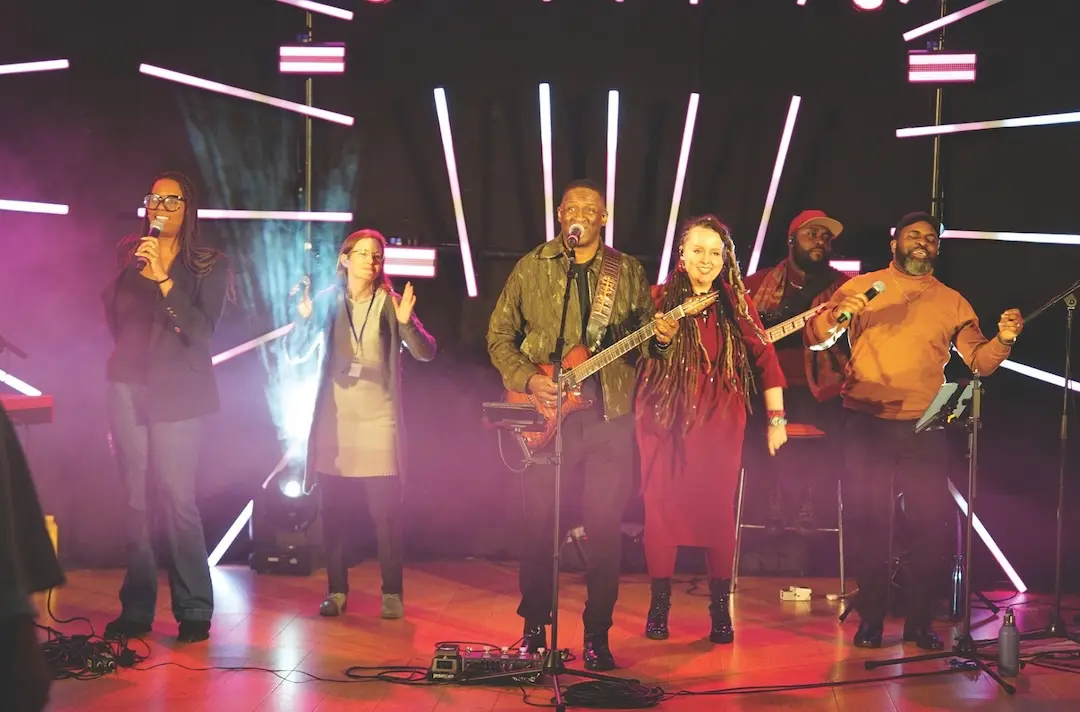 Band playing guitars and singing.