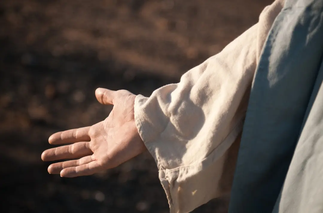 The arm of Jesus outstretched.