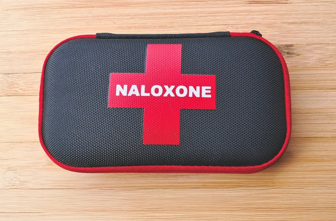 A photo shows a naloxone kit.