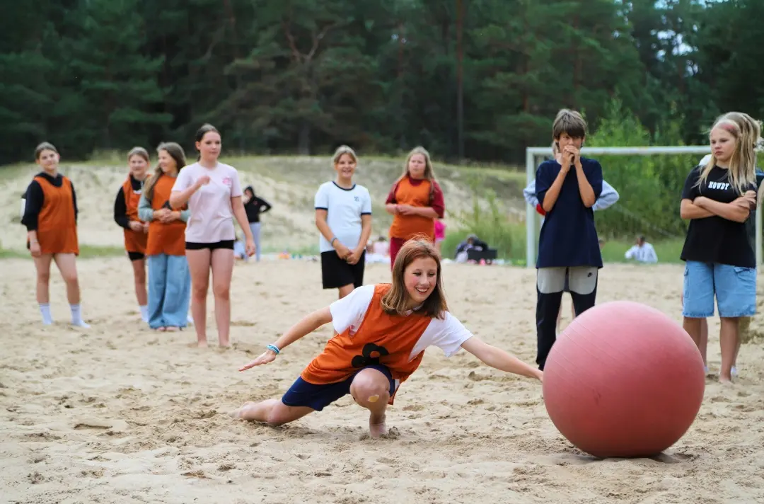 A photo shows an activity at Loksa youth camp.