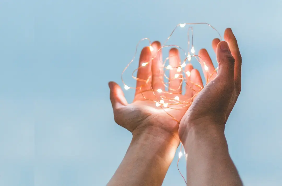 A photo shows hands holding lights