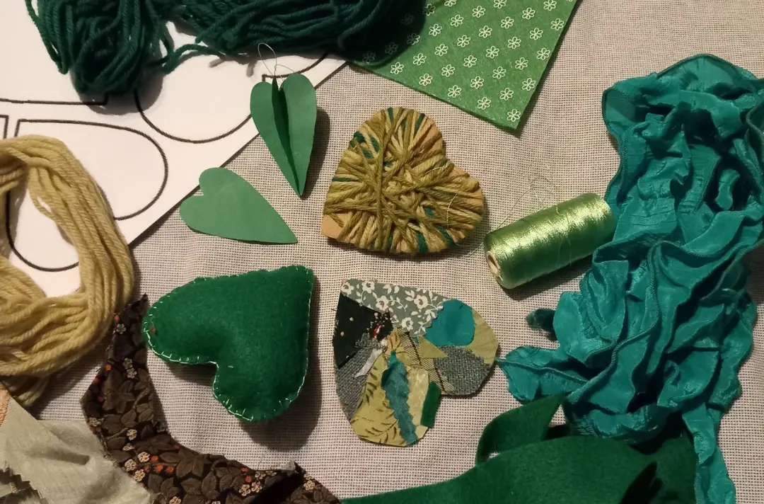 A photo shows some green hearts and crafting equipment.