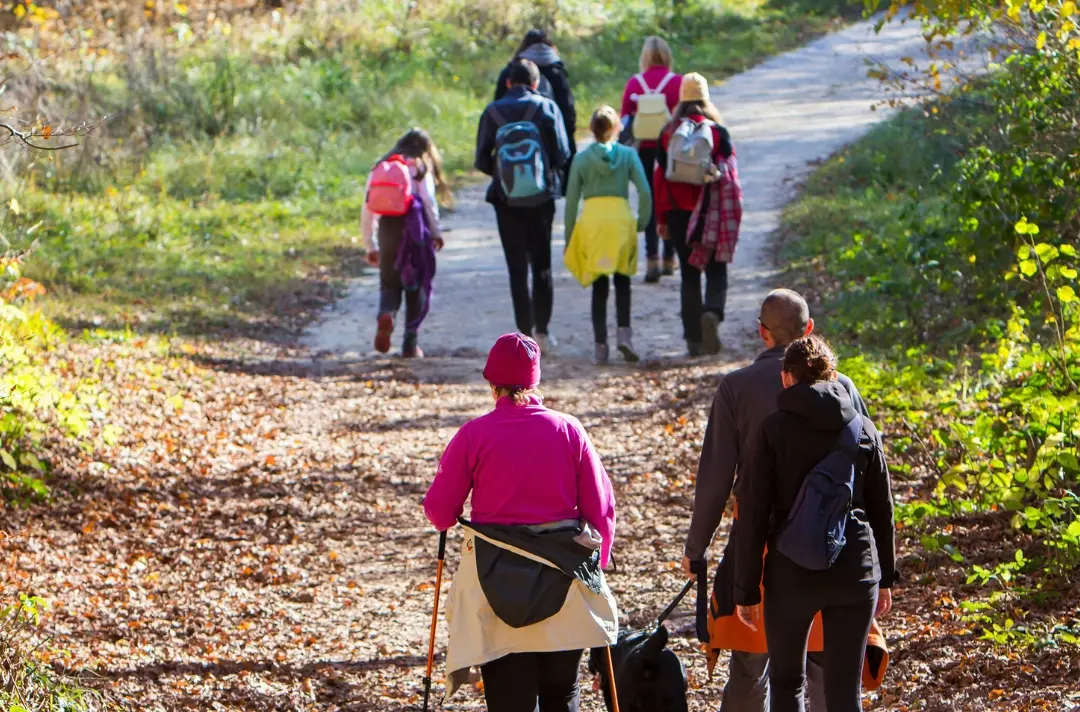 A photo shows a group of people walking together.