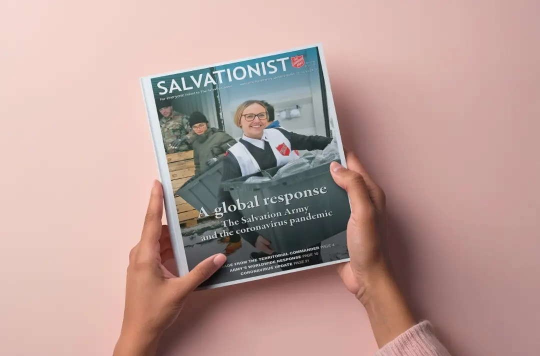 A photo shows someone holding the first issue of Salvationist published after the start of the Covid-19 pandemic lockdowns.