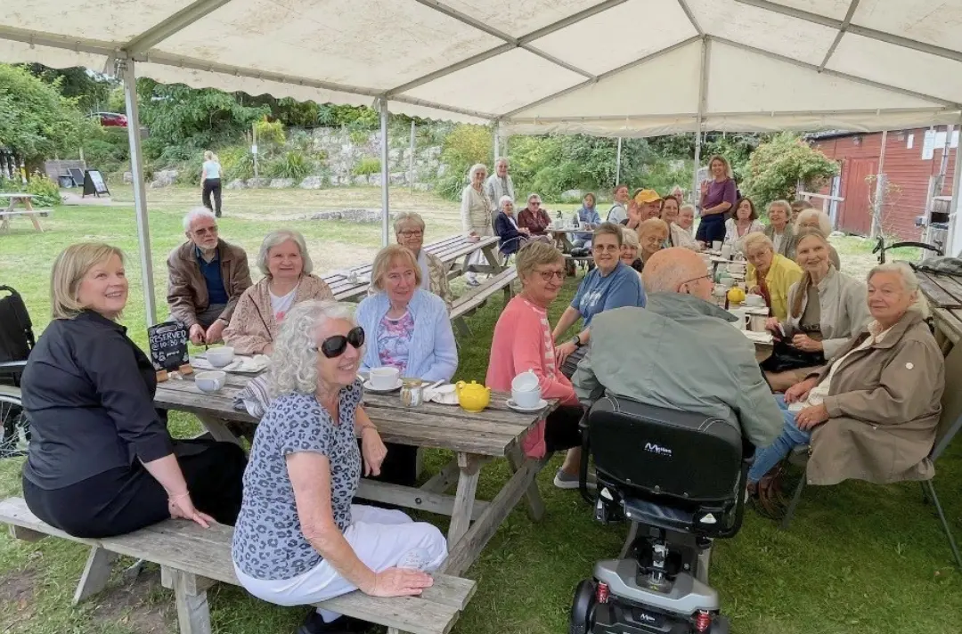 A photo shows a Helping-Hand Appeal fundraising event.