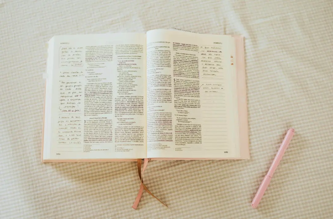 A photo shows a Bible filled with journalling notes.