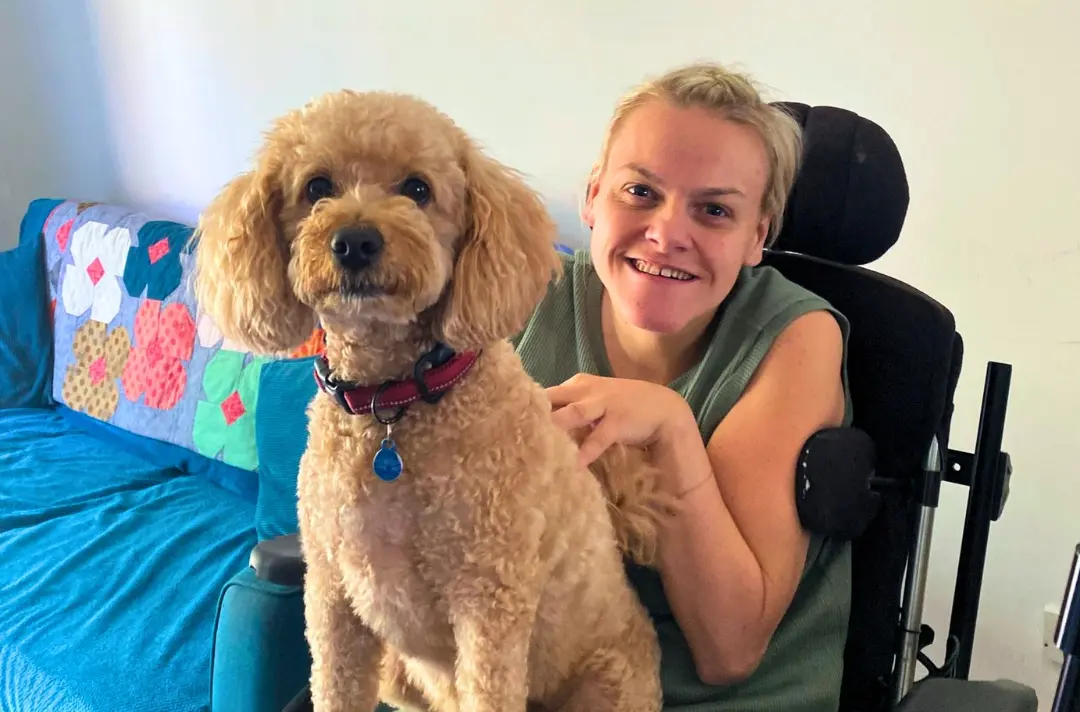 A photo shows Jess Hunter with her dog.