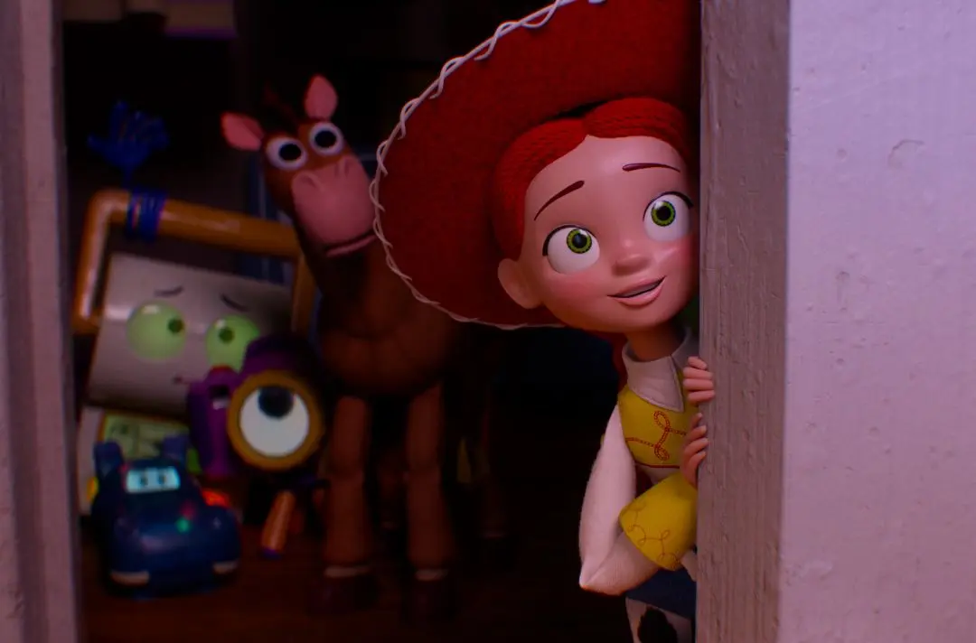 Toy characters, including the cow girl Jessie, look with wide-eyed wonder from behind a door.