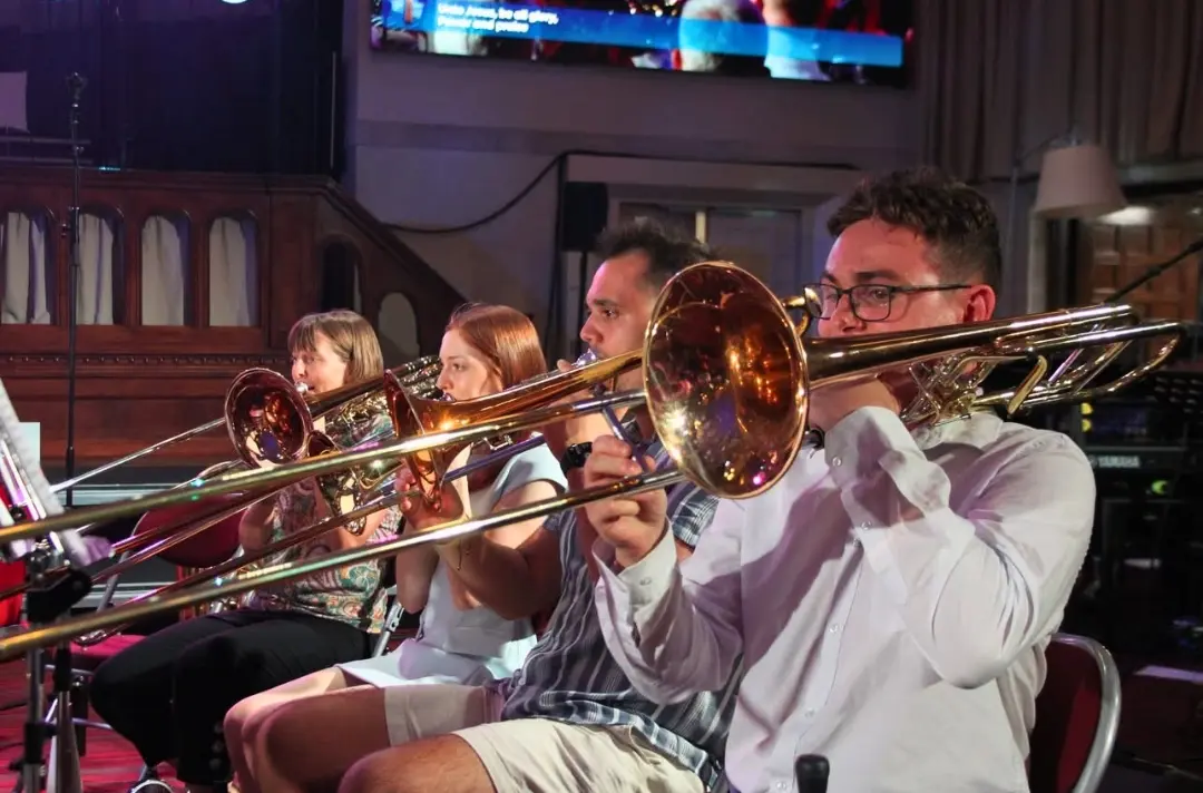 A photo shows brass players at Territorial Music School 2026.