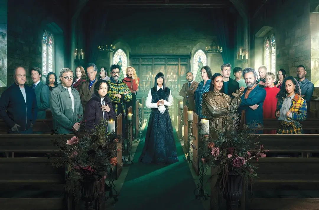 The cast of the 2026 The Celebrity Traitors pose for the camera in a gothic church setting.