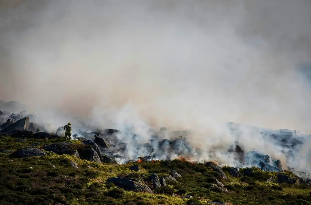A photo shows a wildfire on a Welsh mountain.