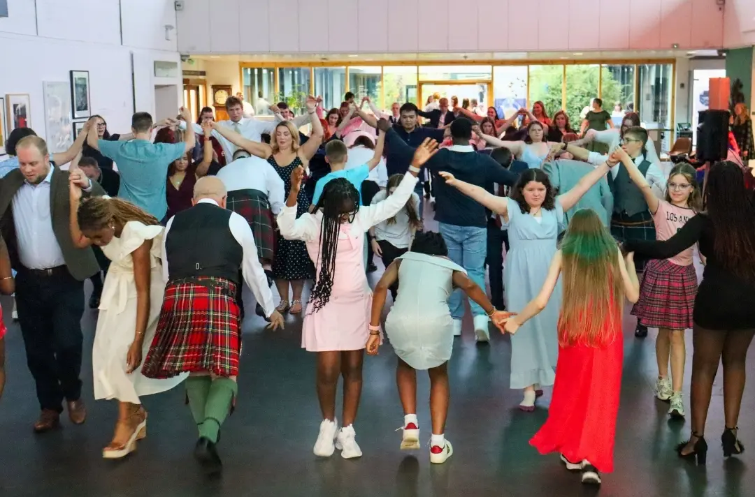 A photo shows people dancing at the 2026 Central and Southern Scotland summer school.