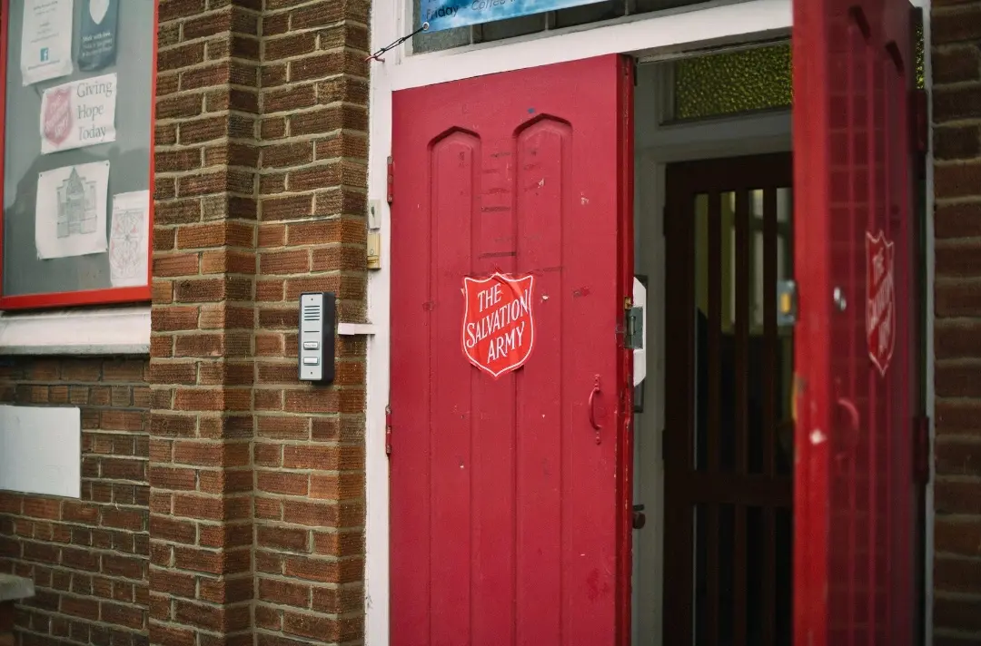 A photo shows the open door of a Salvation Army corps.