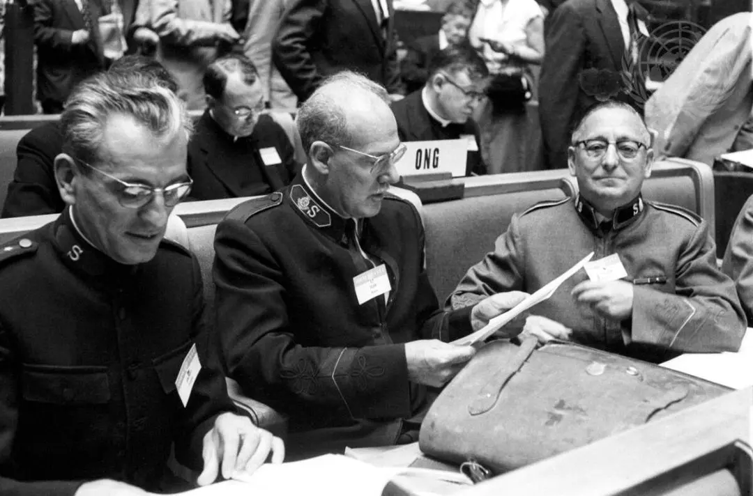 A black and white photograph of three male Salvation Army delegates at the UN Congress on the Prevention of Crime in 1955.
