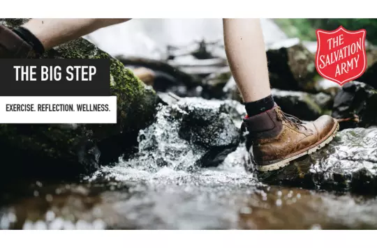 hiking boots walking across a stream