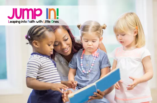 group of little children reading a book