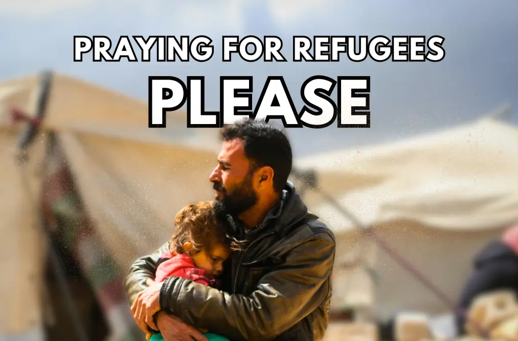 a photo of a man hugging his daughter in a refugee camp, with the words 'praying for refugees please'