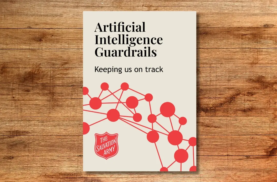 A graphic shows the cover of the AI Guardrails document against a wooden background.