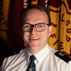 A photo shows Harry Woods.