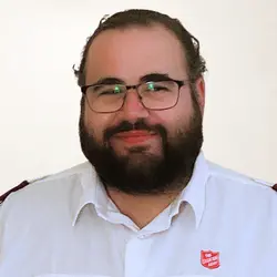 A photo shows Chris Button.